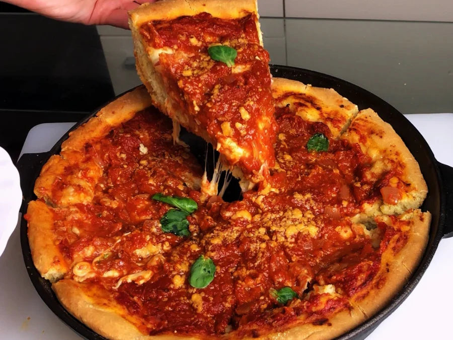 Chicago-style deep dish pizza in a cast iron pan
